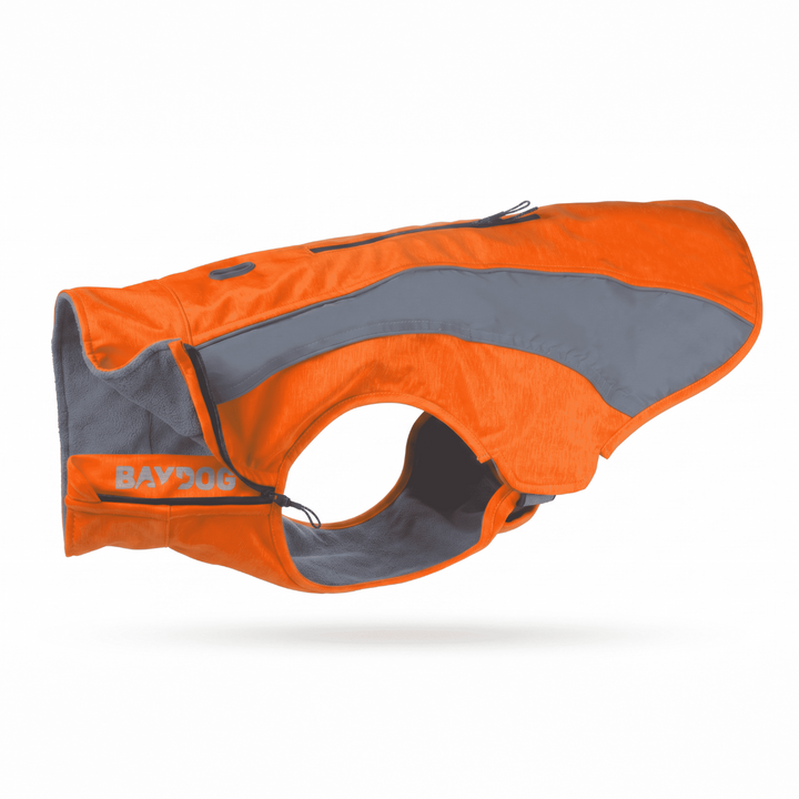 An orange and gray dog jacket with reflective gray panels and a visible BAYDOG logo on the side, shown floating against a white background.